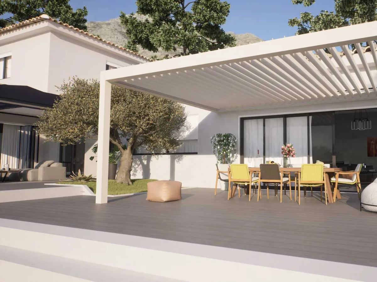 Pergola bioclimatique blanche à lames orientables adossée à une villa provençale
