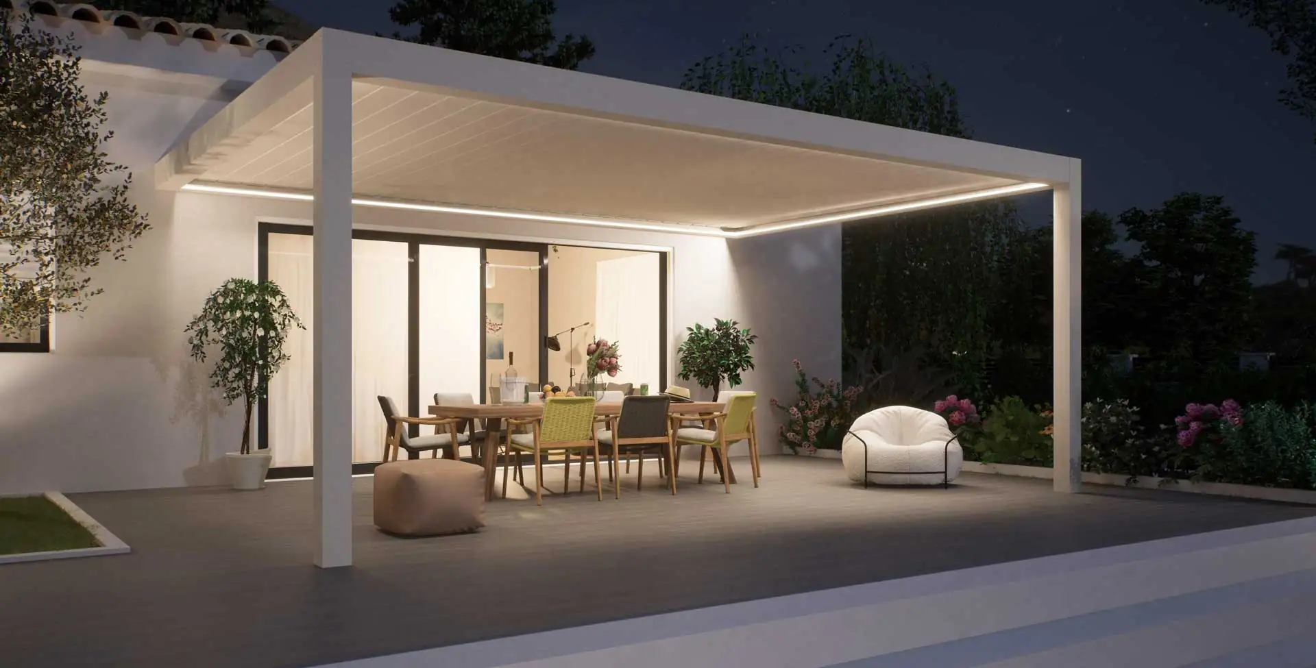 Pergola bioclimatique éclairée par ses LED intégrées à la tombée de la nuit